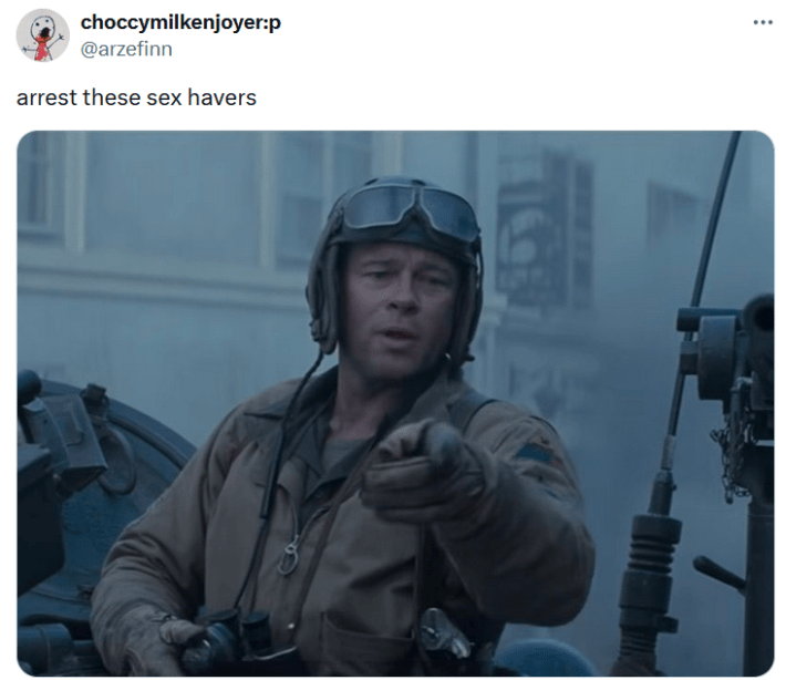 Tweet with an image of a tank driver pointing at the camera and text reading "arrest these sex havers."