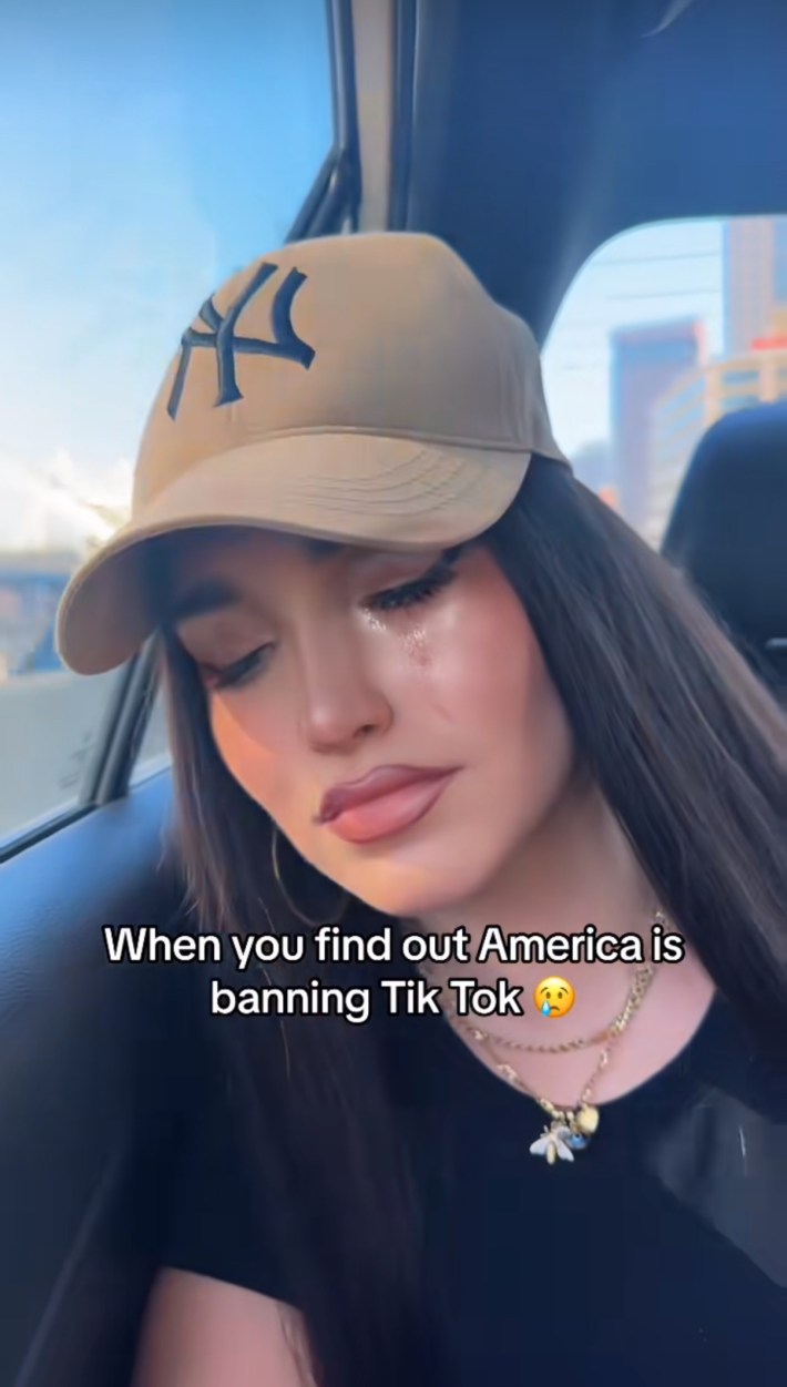 TikTok screenshot of a woman crying in the car. Text overlay reads, "When you find out America is banning TikTok."