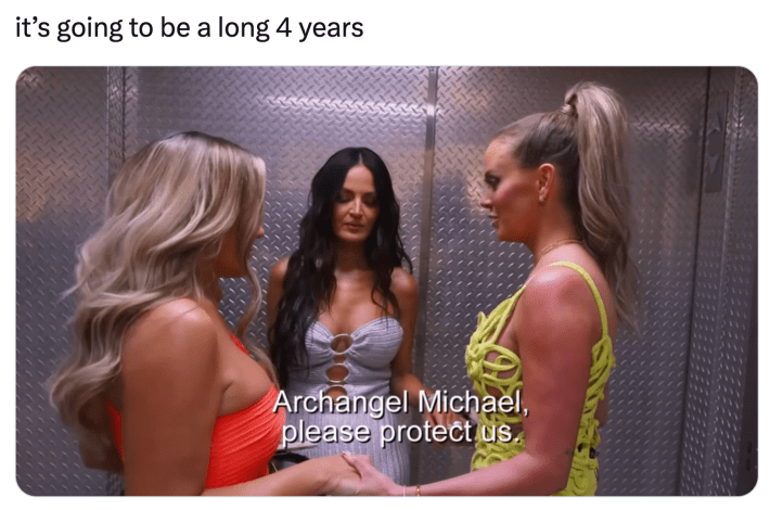 Trump inauguration day 2025 meme, text reads, "it’s going to be a long 4 years" with a screenshot of three women in clubbing dresses in an elevator holding hands saying, "Archangel Michael, please protect us."