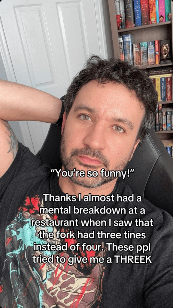 you're so funny meme trend of a man leaning back on his chair and staring at the camera, text reads, "'You're so funny!' Thanks I almost had a mental breakdown at a restaurant when I saw that the fork had three tines instead of four. These ppl tried to give me a THREEK."