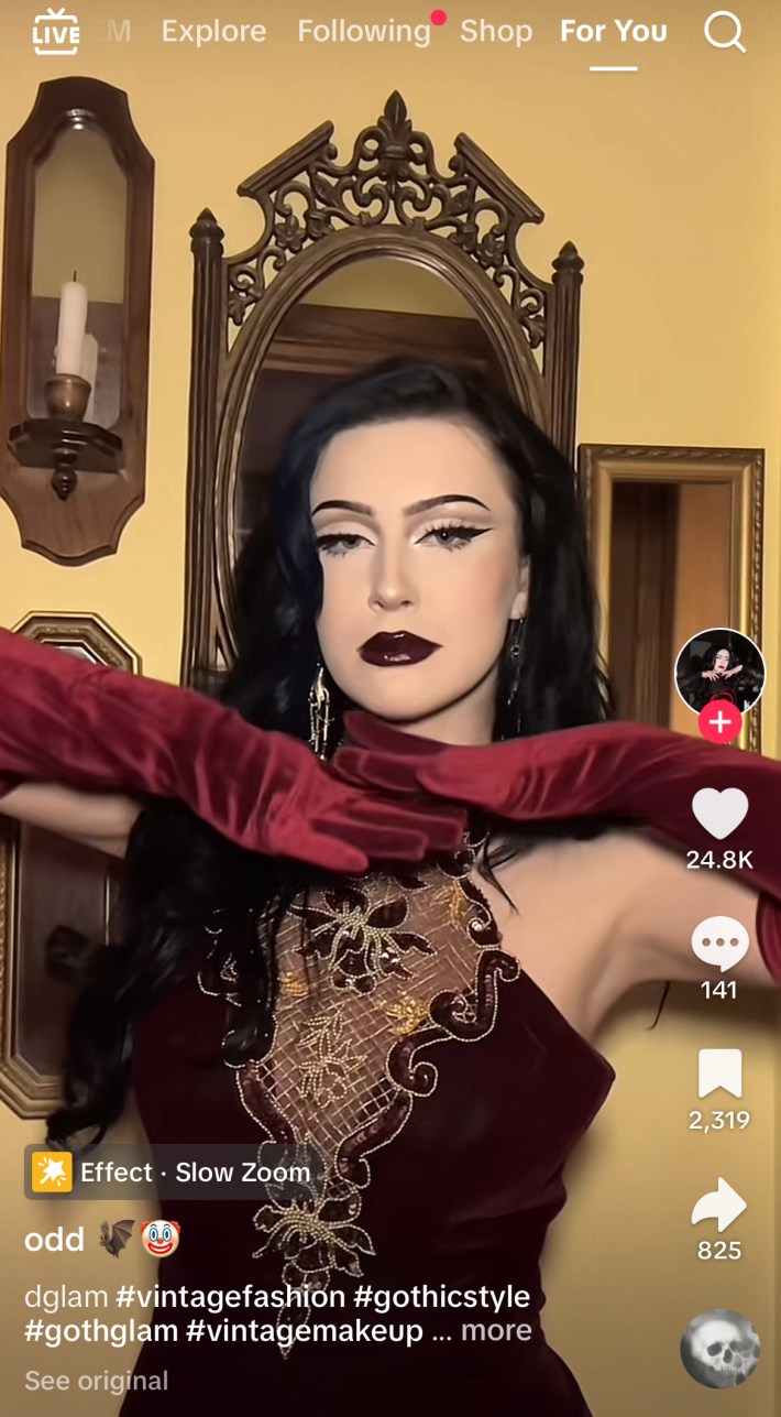 Woman with dark red lipstick and a burgundy velvet dress