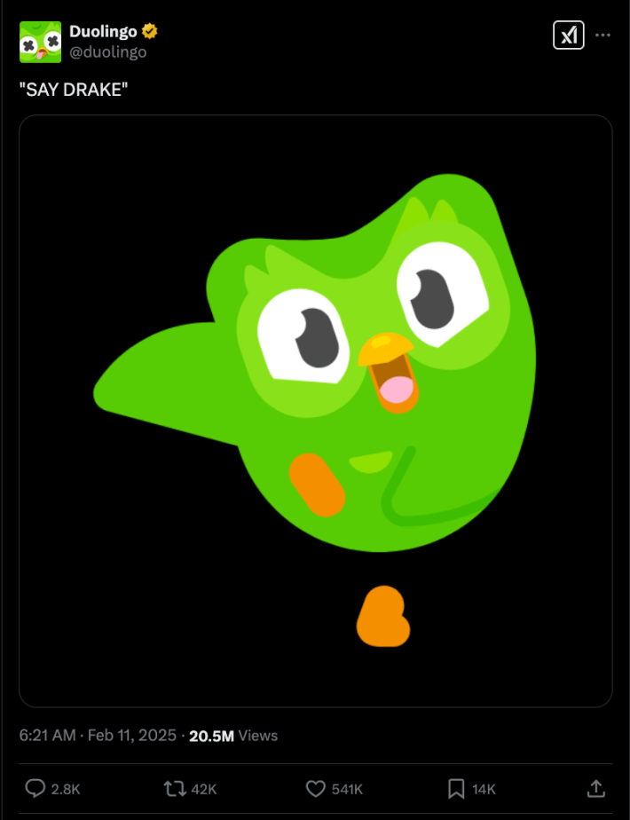An X post of the Duolingo Owl with the caption "say drake"