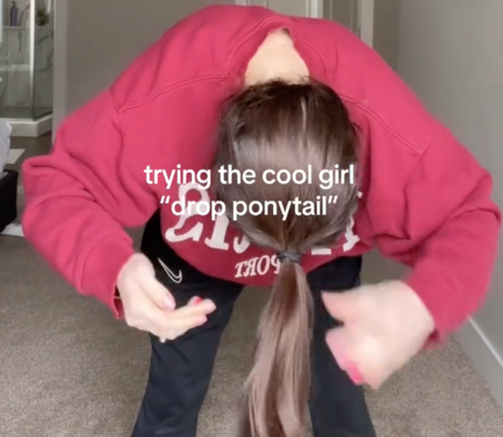 Scrunchie or banding the ponytail in a drop pony style