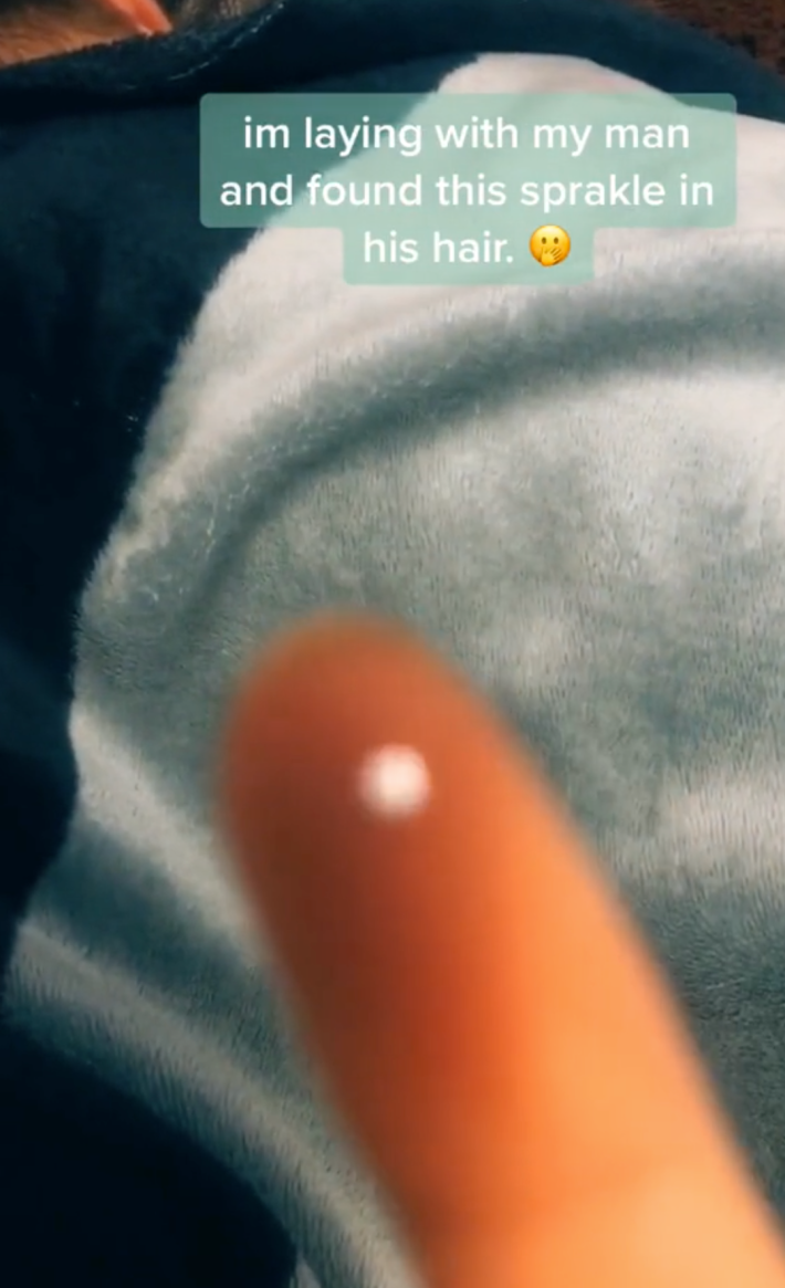 A TikTok of a woman who found a piece of glitter in her man's bed