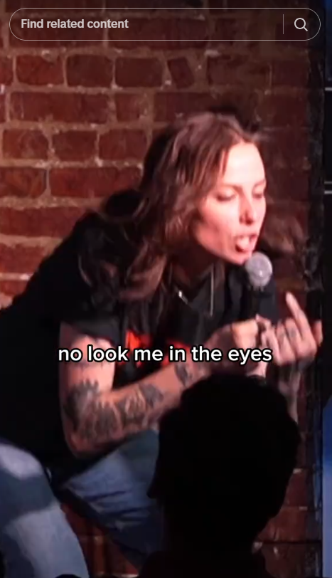 Screenshot of video post by TikTok user natalie cuomo's response to a hackler during a standup set in Washington, D.C.