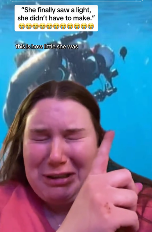TikTok video of a woman crying and pointing at a fish next to a submersible.
