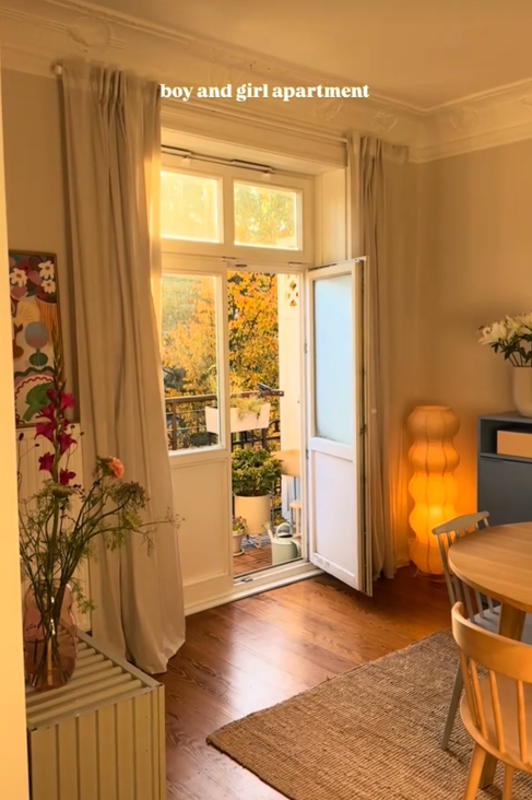 Boy girl apartment video showing a dining room door leading out onto a deck.