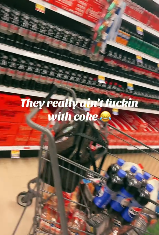 TikTok video showing shelves fully stocked with Coke products behind a cart with Pepsi in it.