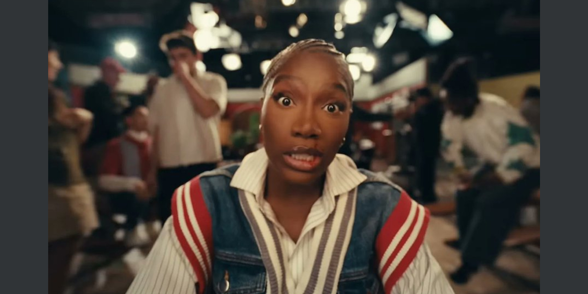 Still image from the music video "Denial is a River" showing the musical artist Doechii.