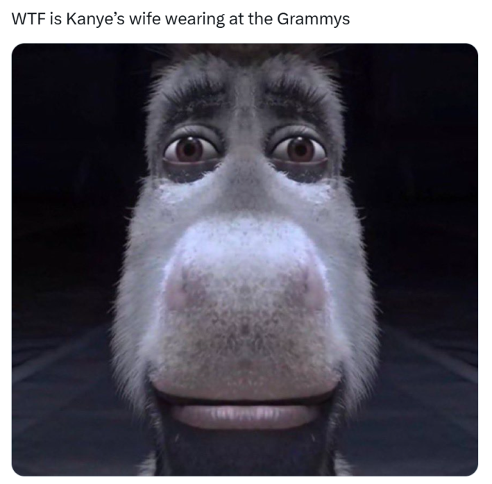 Grammys meme, text reads, "WTF is Kanye’s wife wearing at the Grammys" with a photo of Donkey from Shrek looking upset.