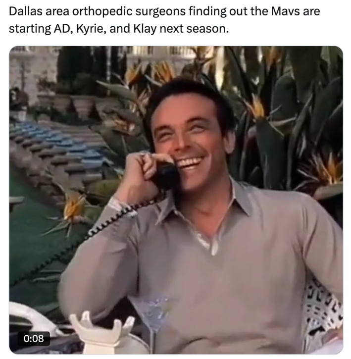 Luka Doncic meme, text reads, "Dallas area orthopedic surgeons finding out the Mavs are starting AD, Kyrie, and Klay next season." with a photo of a man on a cord phone laughing.