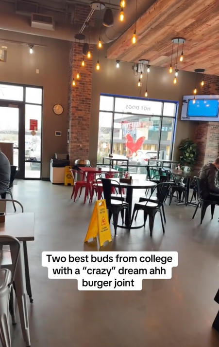 Millennial burger joint TikTok video showing a restaurant with metal chairs and hanging bulb lights.