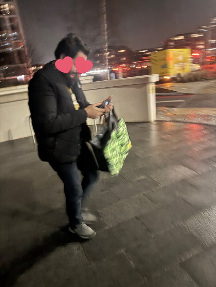 Photo of a man with his face covered by hearts, who is not the listed delivery driver.