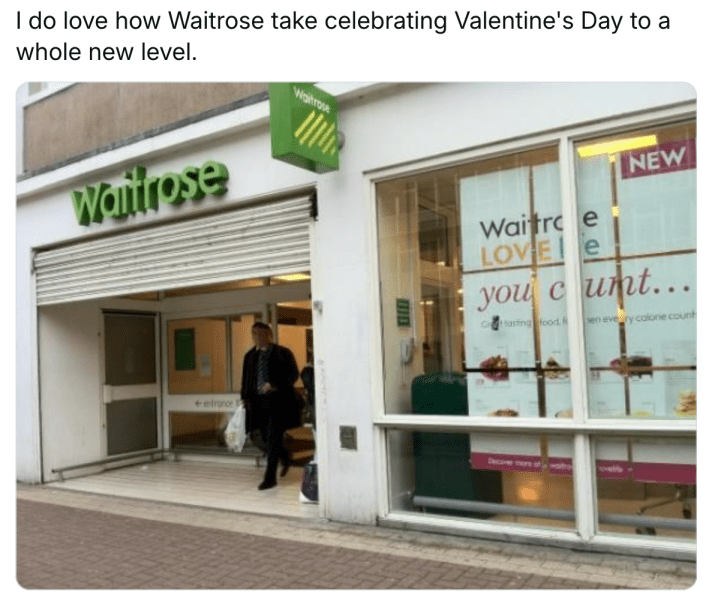 Valentine's Day meme, text reads, "I do love how Waitrose take celebrating Valentine's Day to a whole new level." with a photo showing a sign in the grocery store's window that says, "Waitrose LOVE you c*nt."