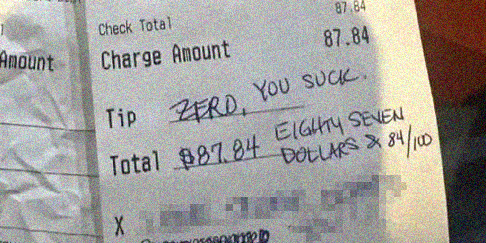 Receipt from restaurant with tip saying "zero, you suck" and redacted text below