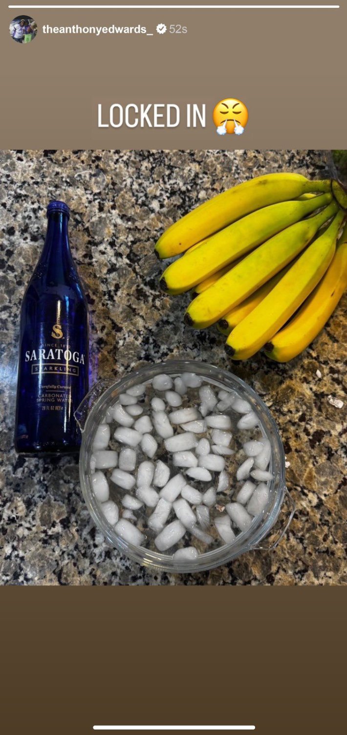 Saratoga water meme, text reads, "Locked in (triumph emoji)" with a photo of Saratoga water bottle, ice bath, and a bunch of bananas on a counter top.