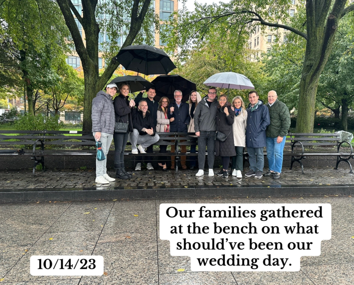 A photo of Jack's friends and family gathering by his memorial bench the day he and his fiance were supposed to be married.
