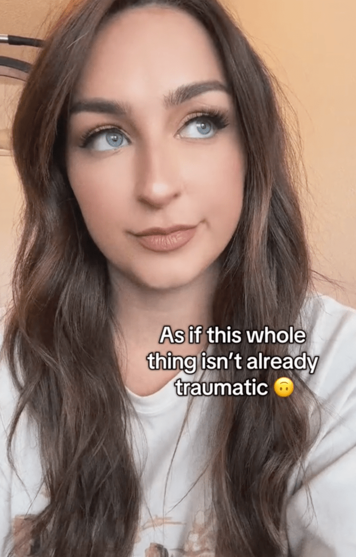 A TIk Tok video where a user recounts her son's traumatizing injury on a carnival cruise, with the caption at this point in the video being "as if it wasn't already traumatic."