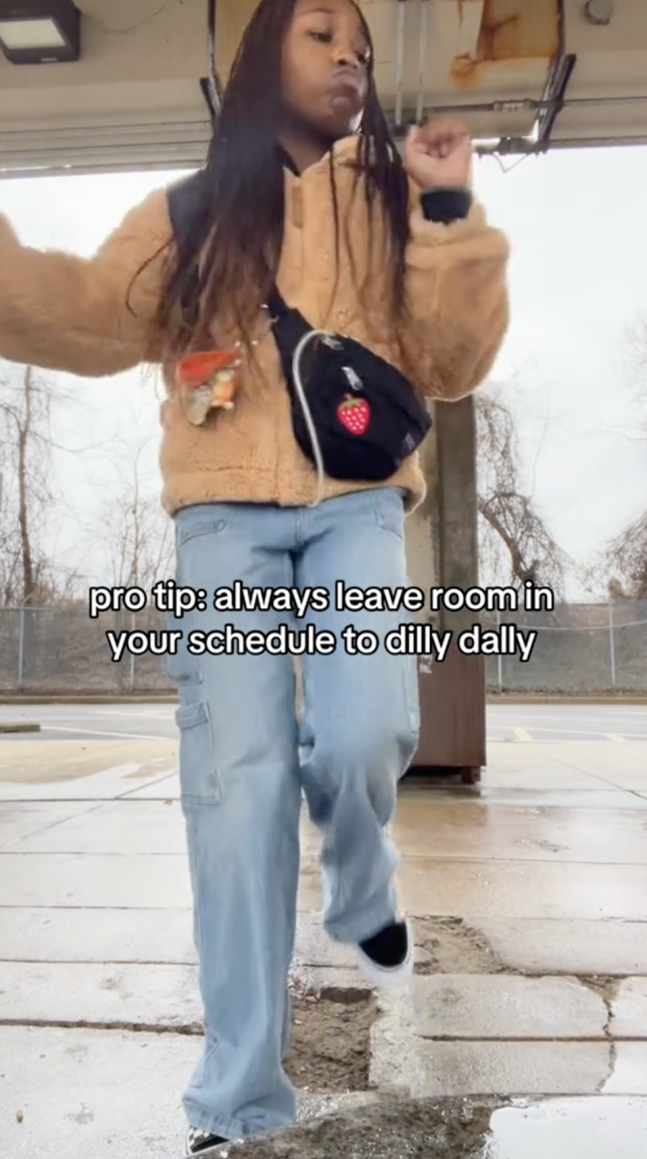 A woman dancing with the caption "you should always leave time in your schedule to dilly dally"