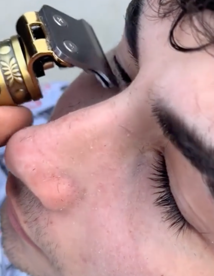 a man shaving down his eyelashes