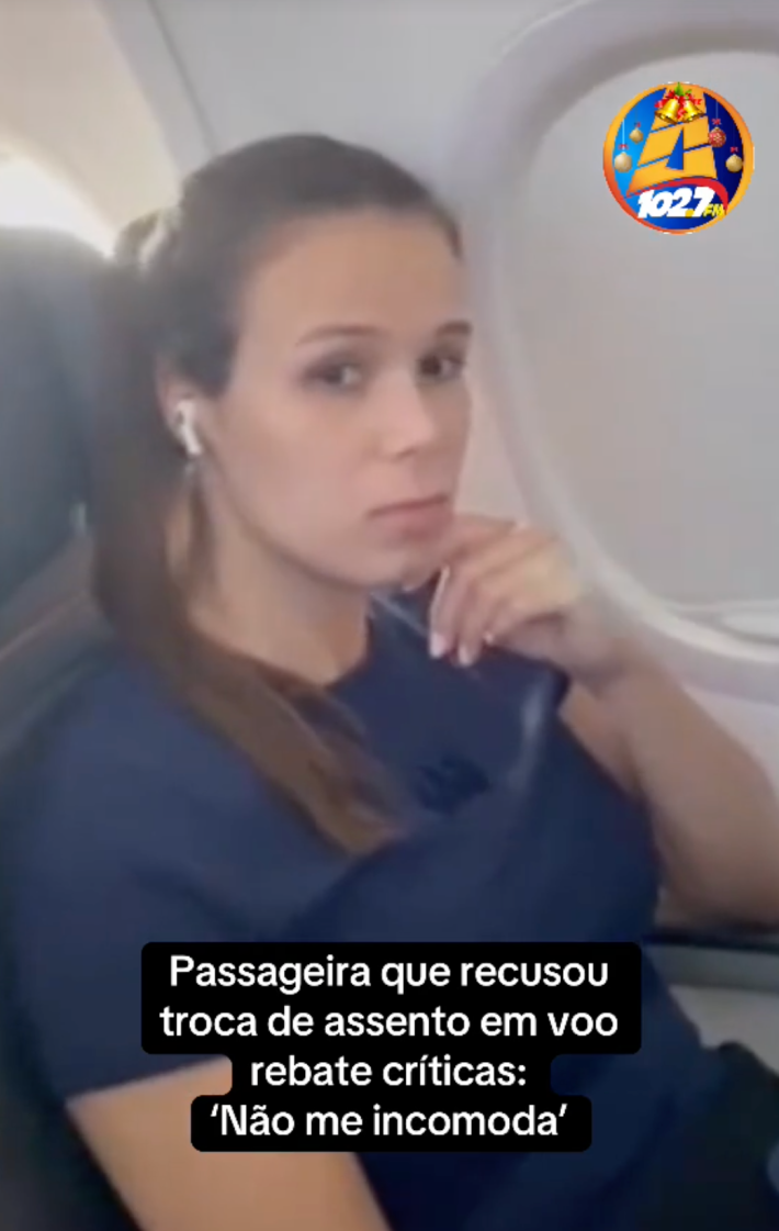 A still of a woman refusing to give up her seat on a plane