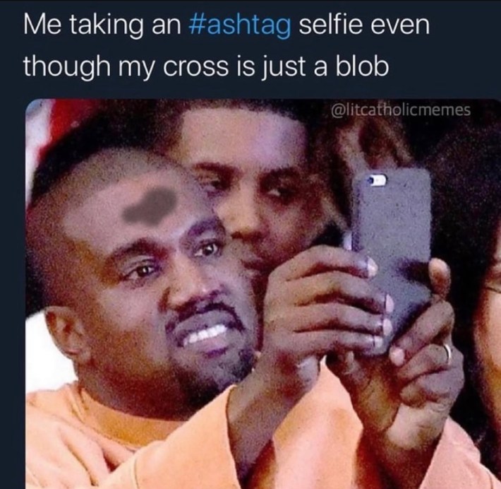 Ash Wednesday meme, text reads, "Me taking an #ashtag selfie even though my cross is just a blob." with a photo of Kanye West with a phone.