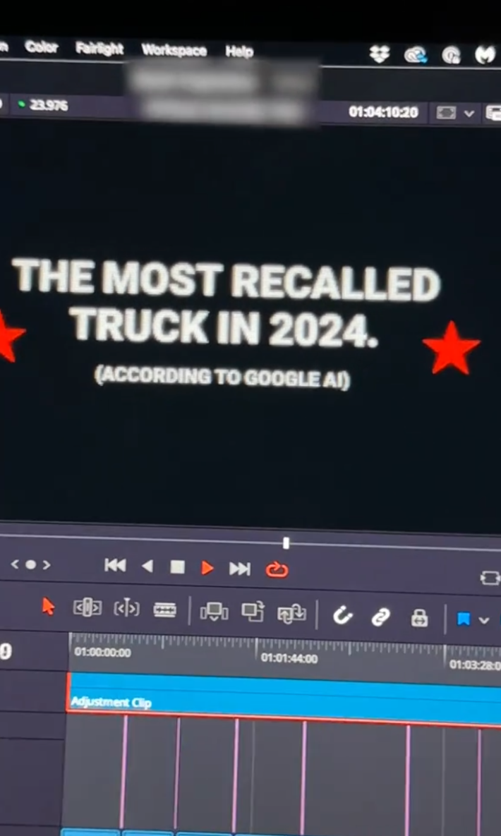 A view of the Cybertruck Hunters' projection video, which is over an hour long. Text on the computer screen reads, "The most recalled truck in 2024 (According to Google AI)"