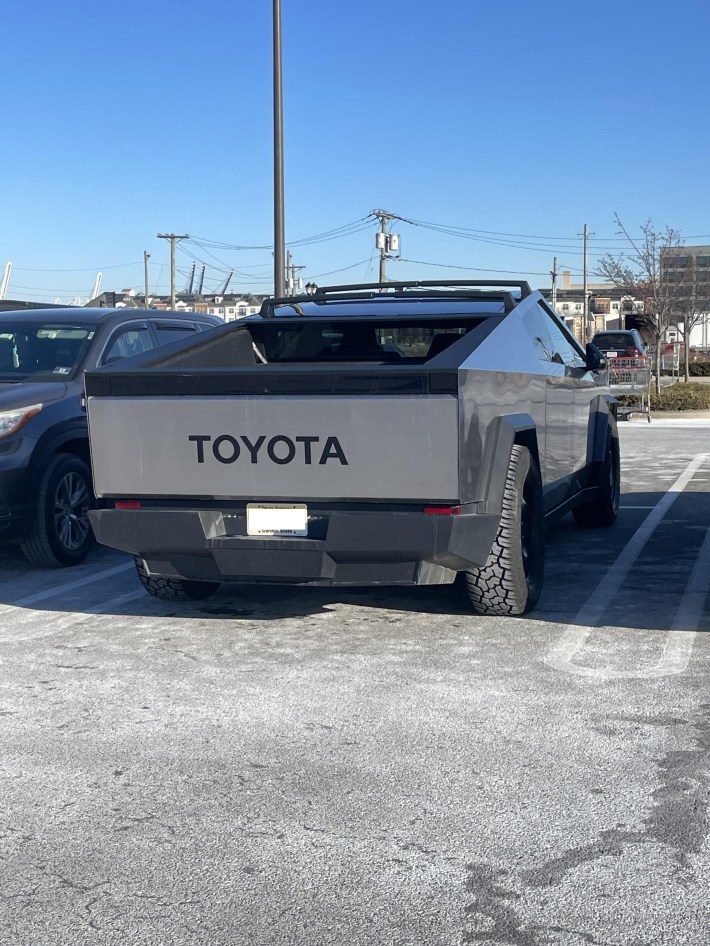 A Cybertruck with the word "TOYOTA" on the back.