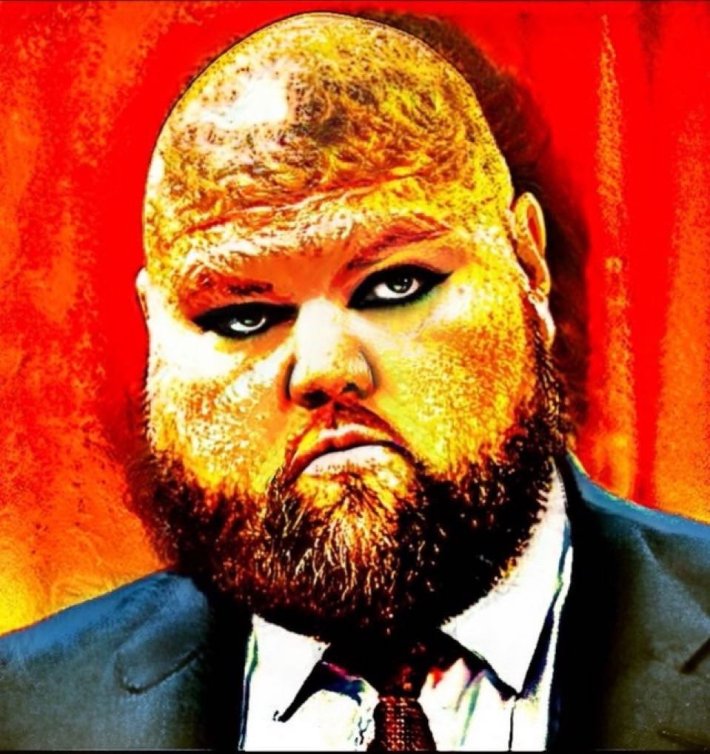 The US Vice President Photoshopped with heavy eye makeup, a bald head, and wide face on an orange background.