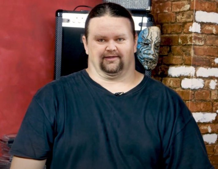 The US Vice President Photoshopped into a man with a ponytail and small head on a large man with a black t-shirt.