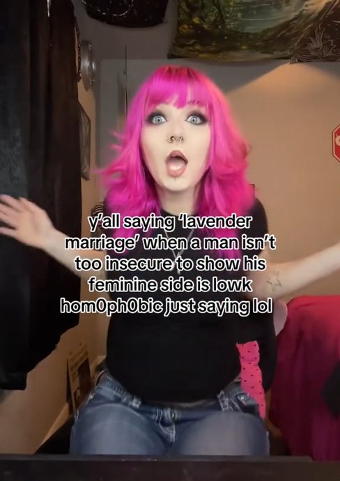 TikTok video showing a woman with pink hair singing to the camera with a caption reading "y'all say 'lavender marriage' when a man isn't too insecure to show his feminine side is lowk homophobic just saying lol."