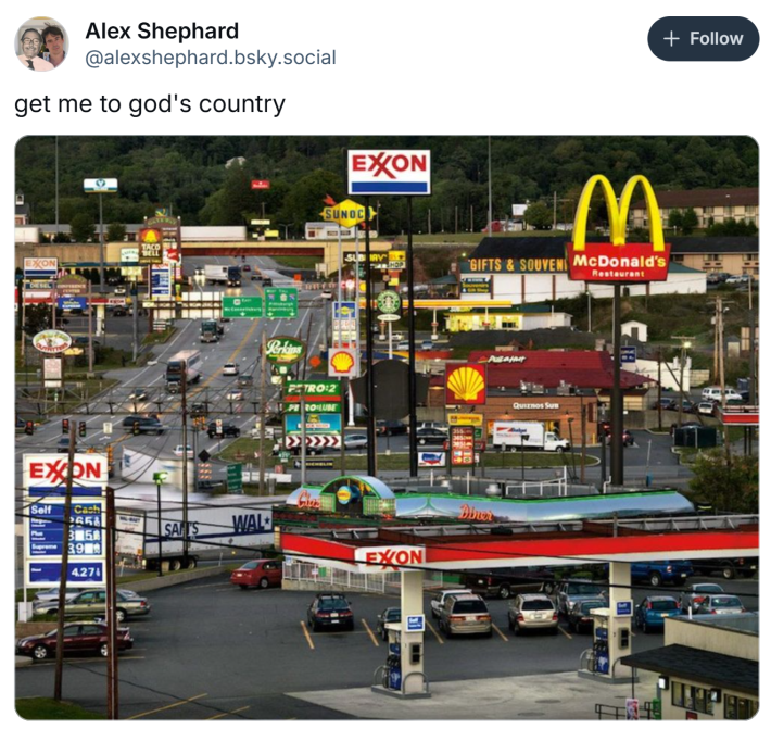 "Get me to God's country" meme with a photo of a busy city street filled with signs for gas stations and McDonalds.
