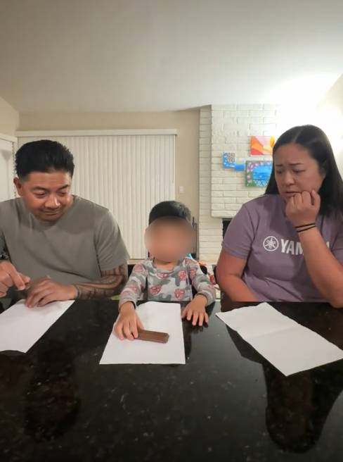 Cookie share prank TikTok video showing a child who has two Kit Kats while his mom looks sad.