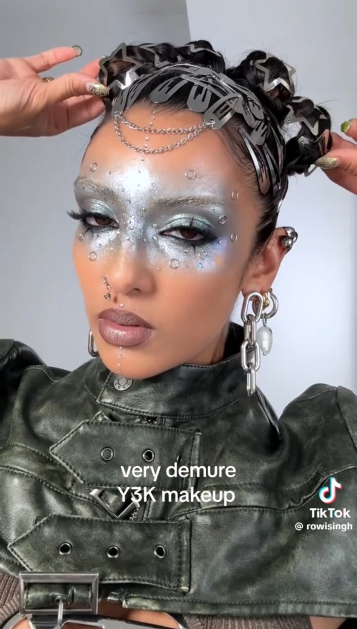 Metallic Y3K makeup and lots of hair clips on head