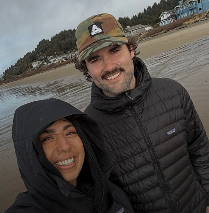 A selfie of a woman and her boyfriend on the beach