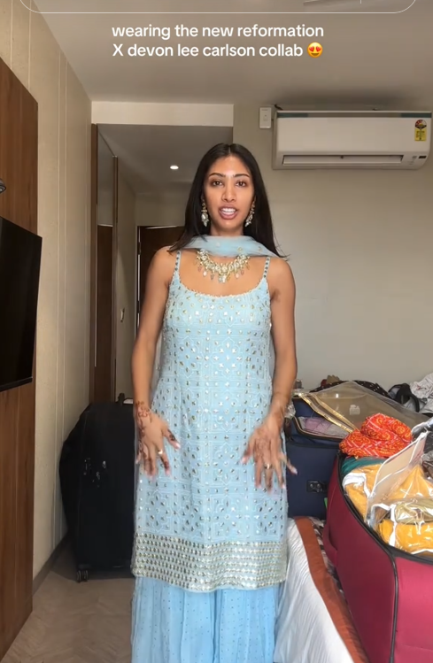 Devon Lee Carlson x Reformation backlash TikTok video showing a woman in a traditional lehenga and dupatta.