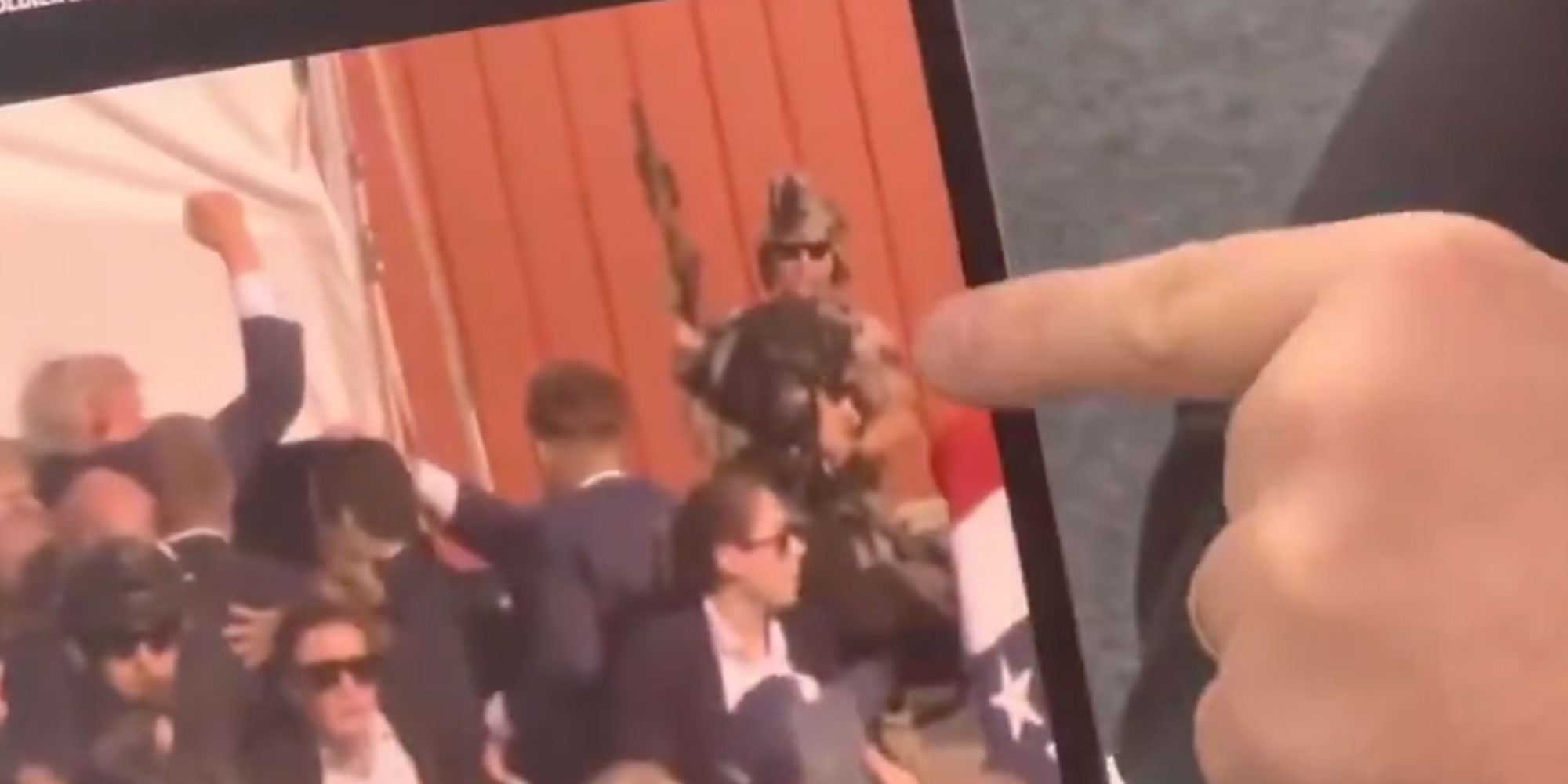 Screenshot from X user @gregkellyusa of Greg Kelly pointing at a Gunman on an Ipad video.