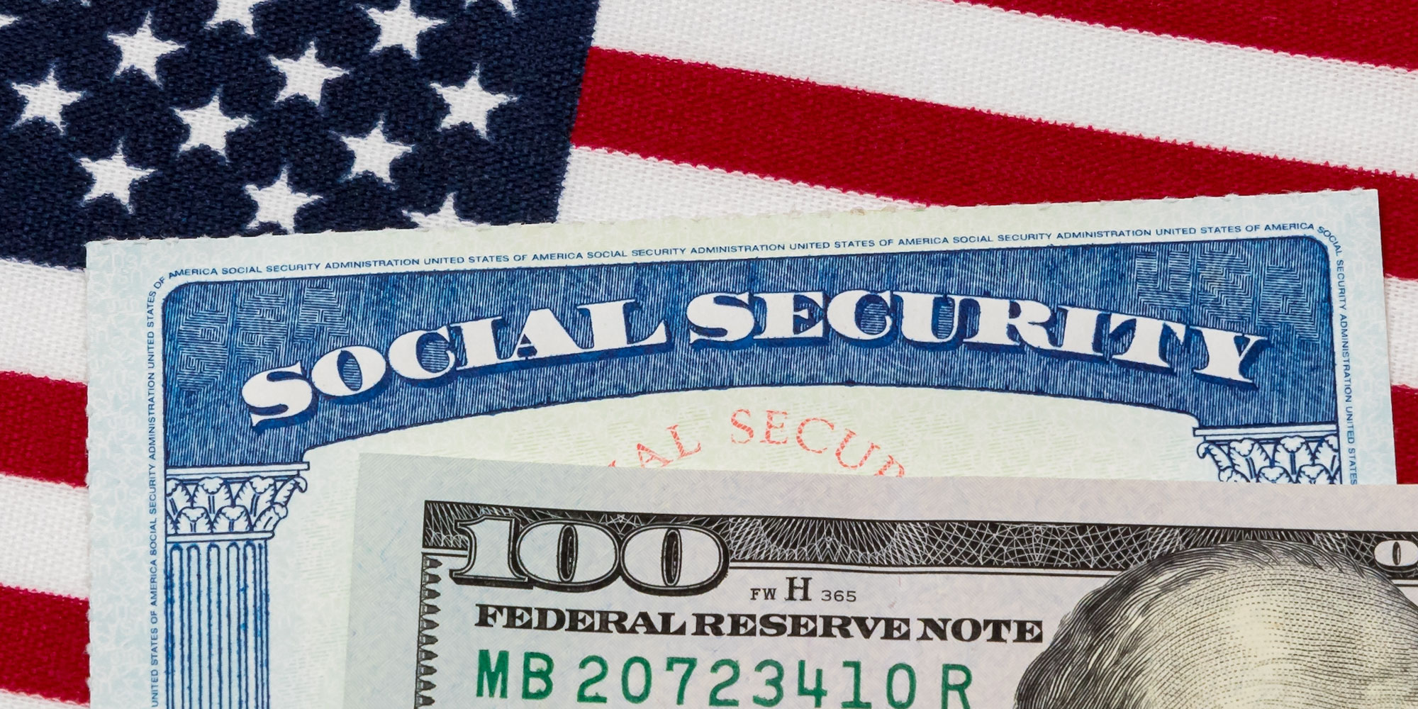 Photo of an American Flag, a Social Security Card, and a $100 bill