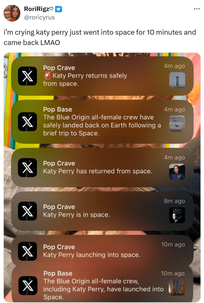 Tweet that reads, "i’m crying katy perry just went into space for 10 minutes and came back LMAO" with a screenshot of notifications from Pop Crave.