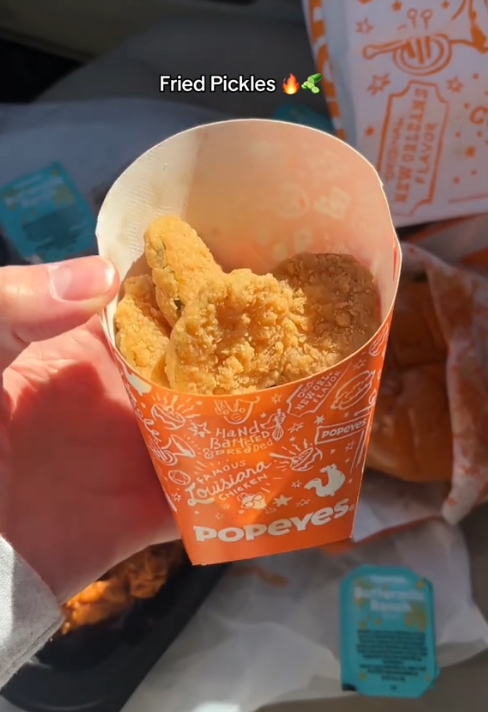 Popeyes pickle menu TikTok review showing a container of the fried pickles.