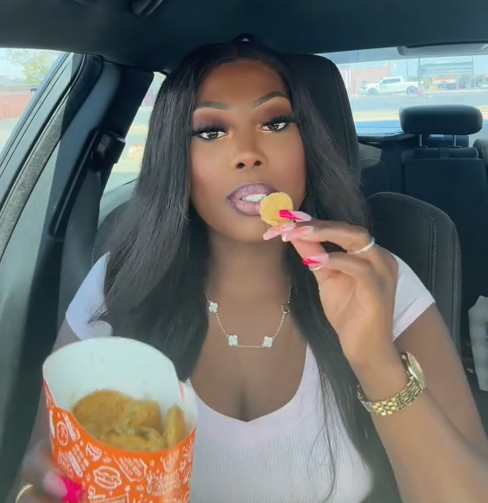 Popeyes pickle menu TikTok review with a woman eating the fried pickles in her car.