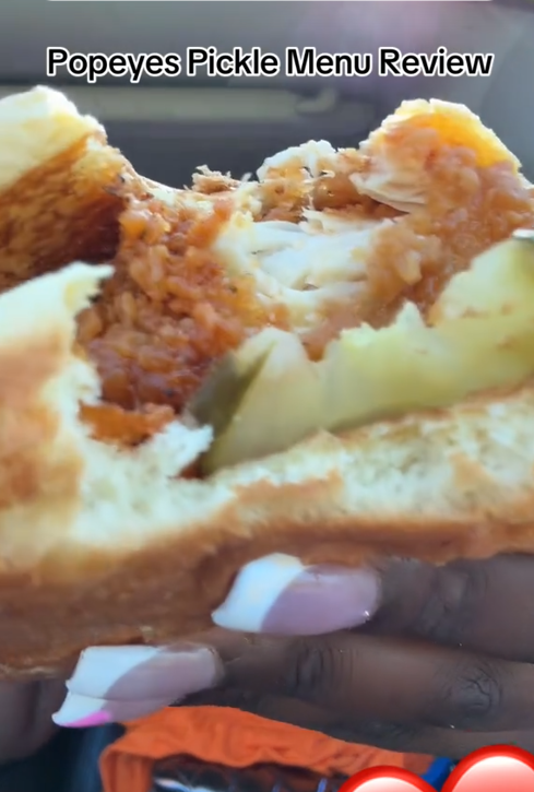 Popeyes pickle menu TikTok review showing the pickle glaze sandwich up close.