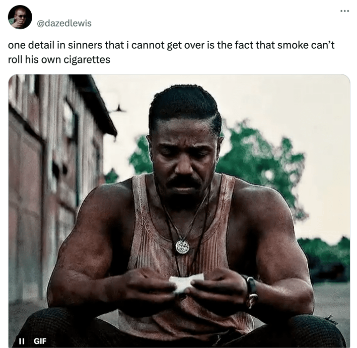 Tweet that reads, "one detail in sinners that i cannot get over is the fact that smoke can’t roll his own cigarettes" with a GIF of Smoke's hands shaking as he tries to roll a cigarette.
