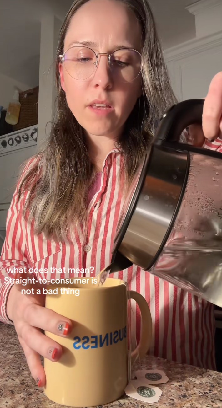 A woman talking to the camera while pouring tea, saying, "What does it mean? Straight to consumer is not a bad thing."