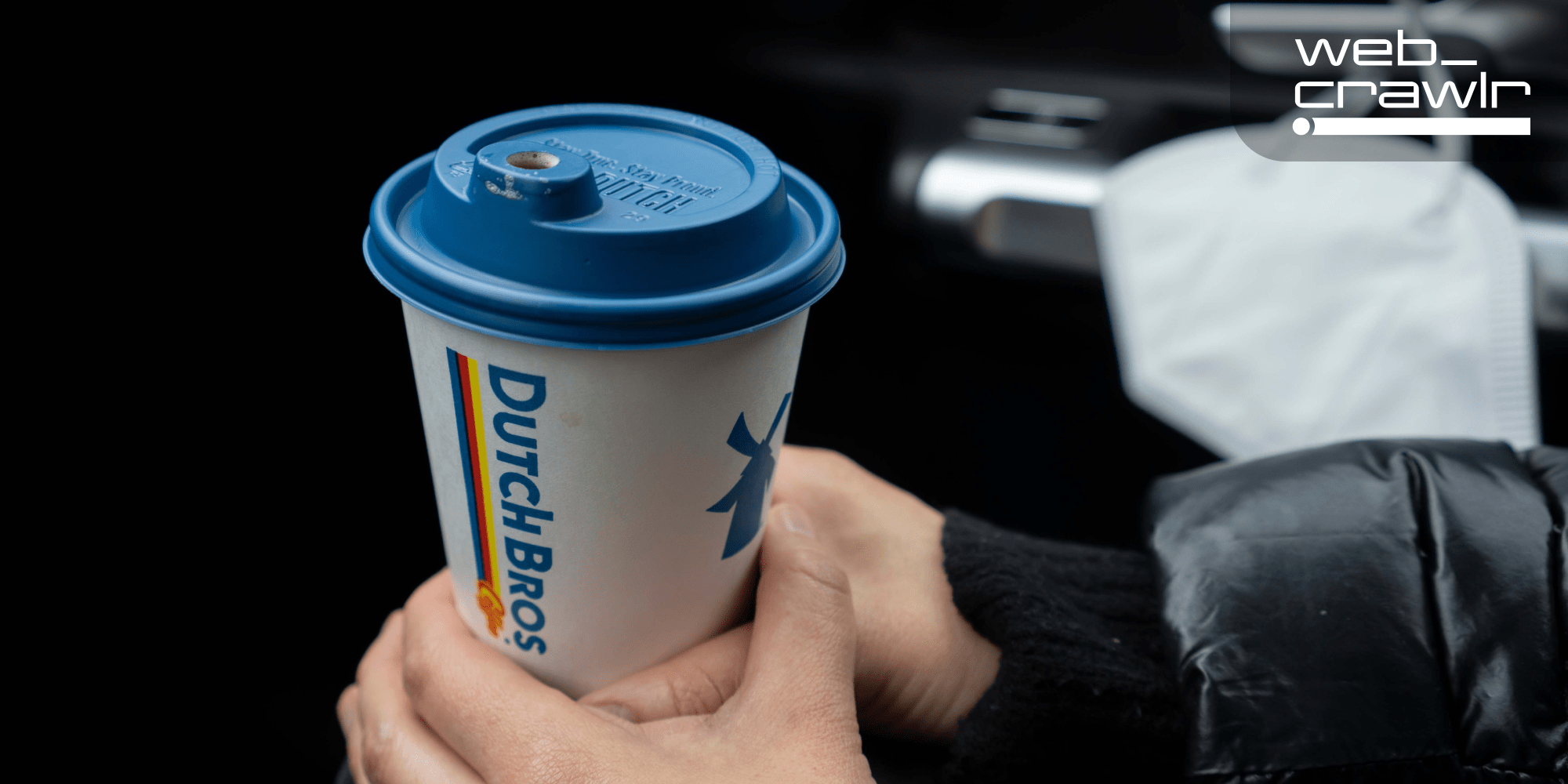 A Dutch Bros coffee cup. The Daily Dot newsletter web_crawlr logo is in the top right corner.