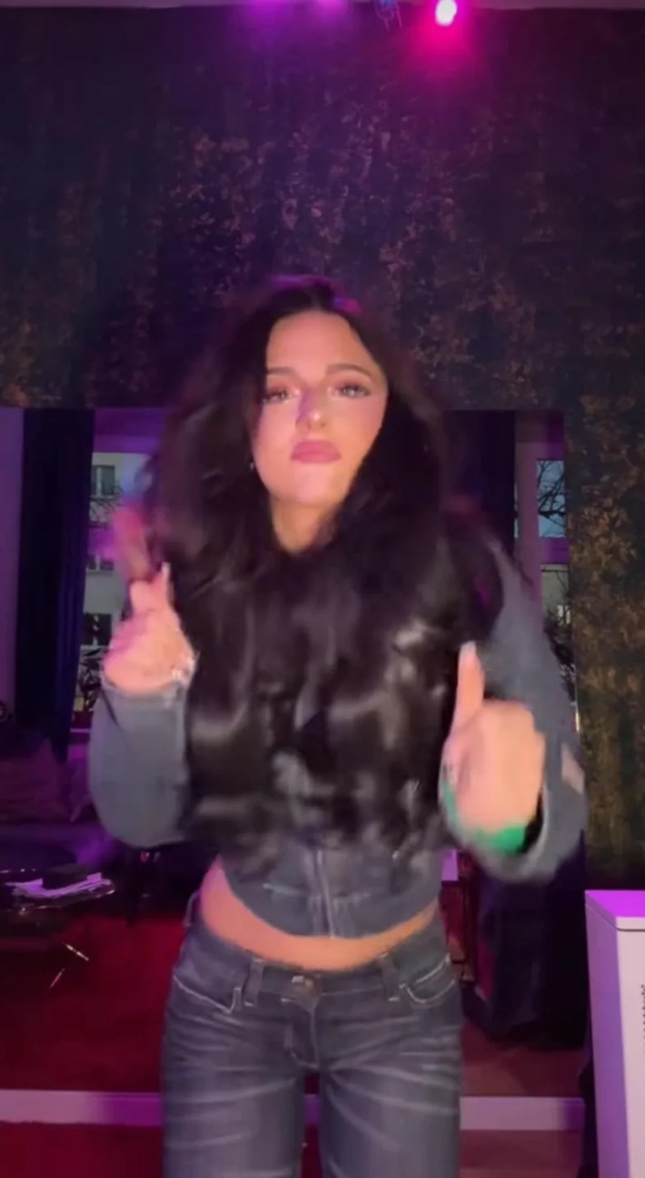 Dancer Chiara performing for the camera in jeans and a jean jacket.