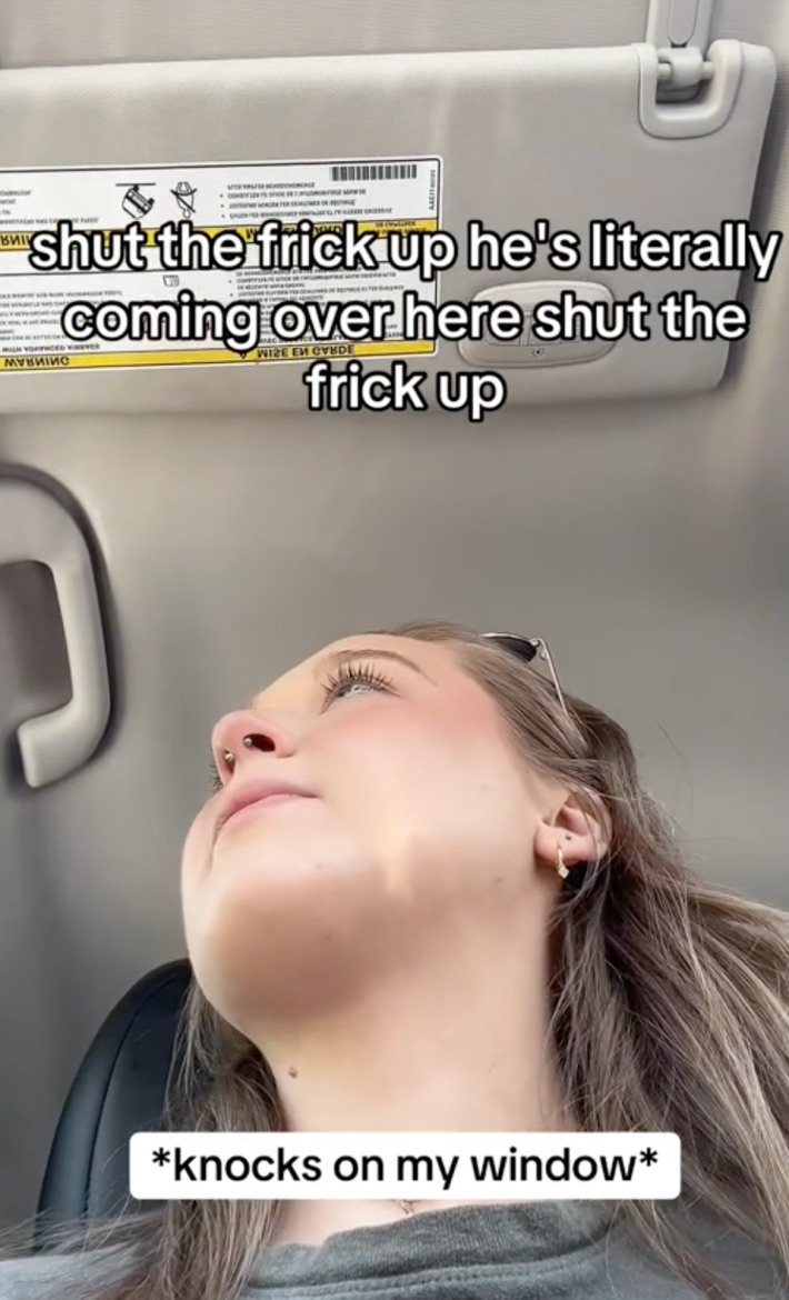 User @lil_tachy on TikTok looking into the camera as a man berates her for using a wheelchair