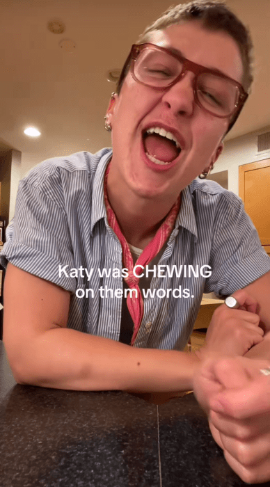 TikToker over-enunciating a Katy Perry song. Text overlay reads, "Katy was CHEWING on them words."