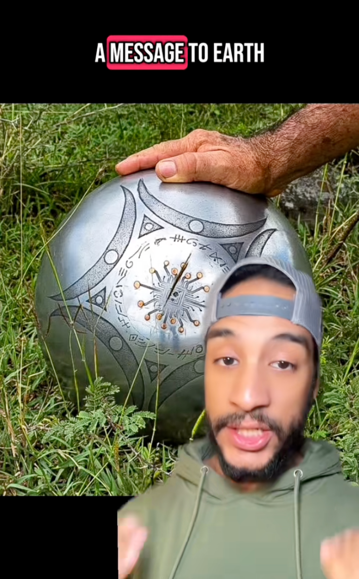 Photo of the UFO sphere found in Buga, Colombia with a TikToker saying, "A message to Earth."