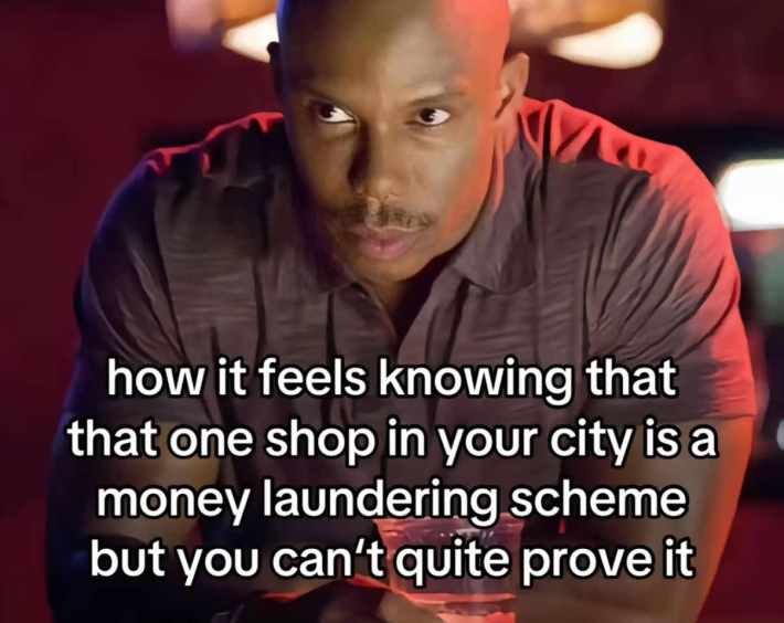 TikTok post of Doakes from 'Dexter' staring. Text overlay reads, "how it feels knowing that that one shop in your city is a money laundering scheme but you can't quite prove it."